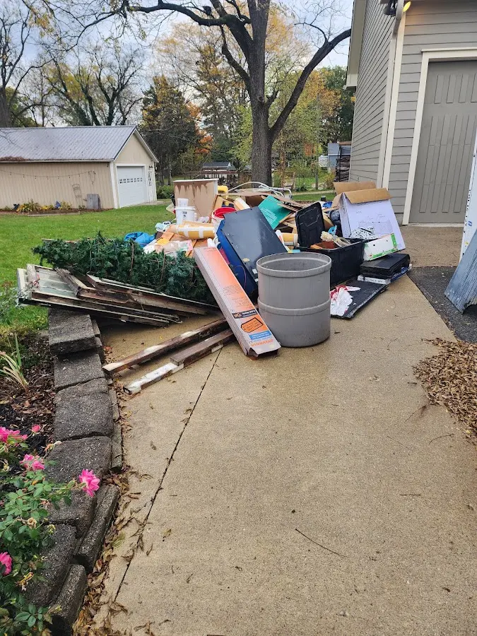 Dumpster being loaded with debris for 30 Yard Dumpster Rental in South Fulton